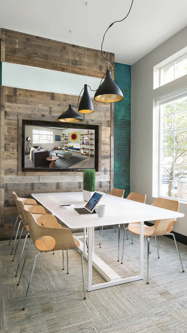 Apartment community business center with conference room at Griffis Belleview Station in Denver, Colorado.