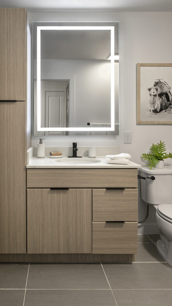 Apartment Bathroom with LED vanity mirror.