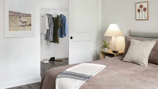 Spacious apartment Bedroom with Large Closet and Wood Floors.