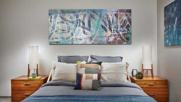 Spacious apartment bedroom with plush carpet flooring.