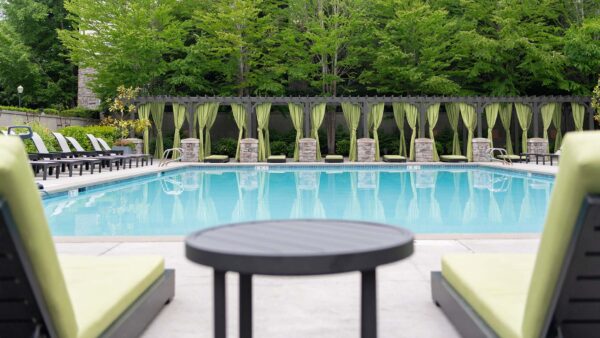 Apartment community resort style pool + cabanas at Griffis North Creek in Bothell, Washington.