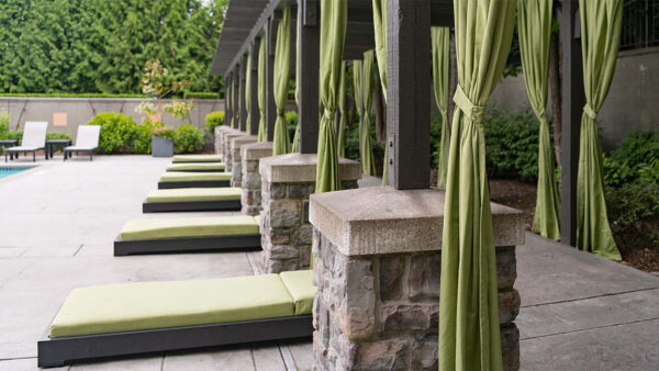 Apartment community resort style pool + cabanas at Griffis North Creek in Bothell, Washington.