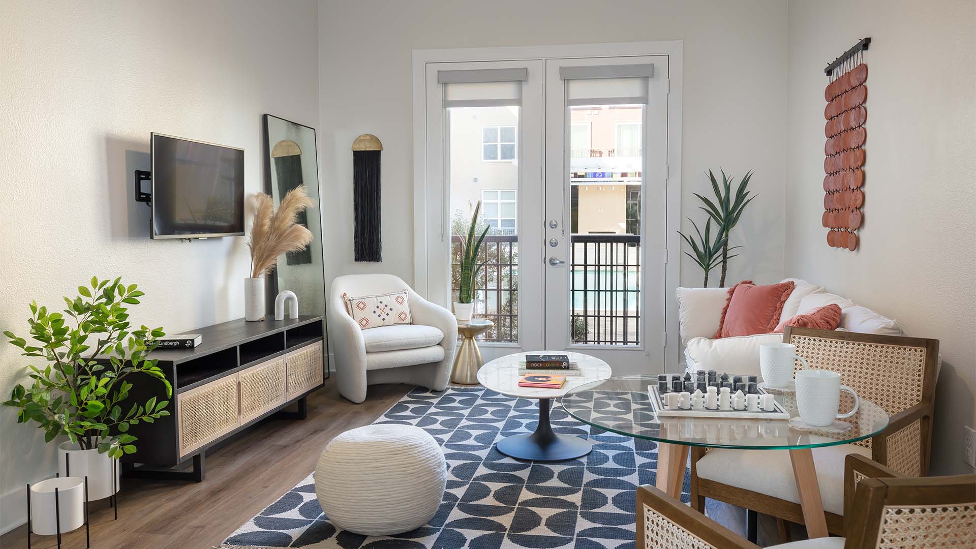 Apartment Living Room with wood floors and Balcony.