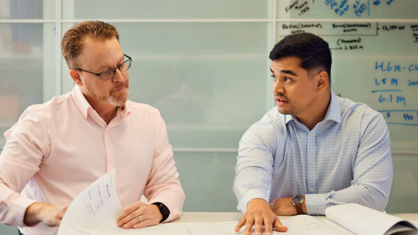Griffis Residential associates working in conference room.