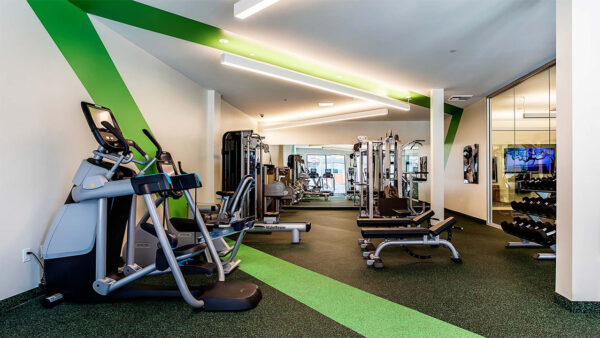 Apartment community 24-hour fitness center with Fitness on Demand™ at Griffis Pine Avenue in Long Beach, California.