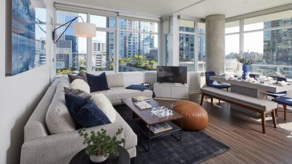 Apartment Dining and Living Room with Hard Wood Flooring and Balcony.