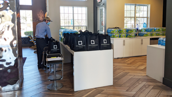 Apartment office filled with packages of water.