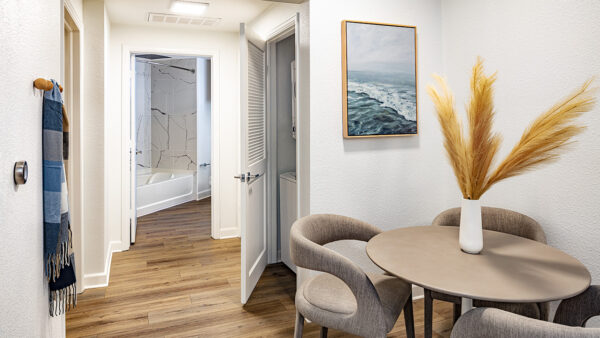 Apartment dining room and in-home washer and dryer.