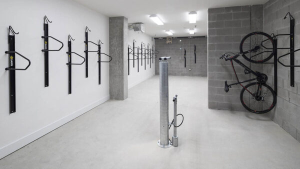 Bike storage room with storage racks and repair station.