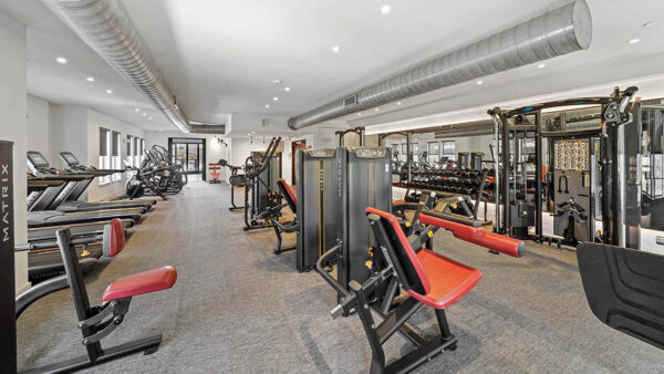 Fitness center with cardio machines and weight equipment.