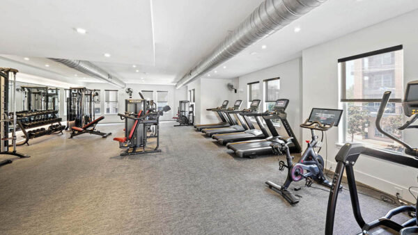 Fitness center with cardio machines and weight equipment.