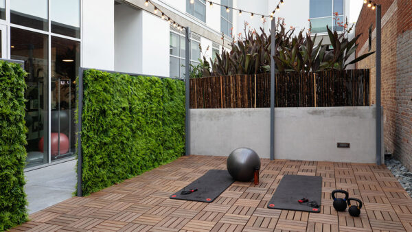 Apartment community outdoor yoga studio at Griffis East Village in San Diego, California.