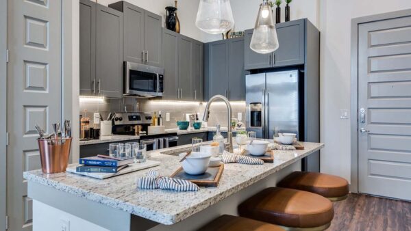 Griffis Frisco apartment kitchen with granite countertops.