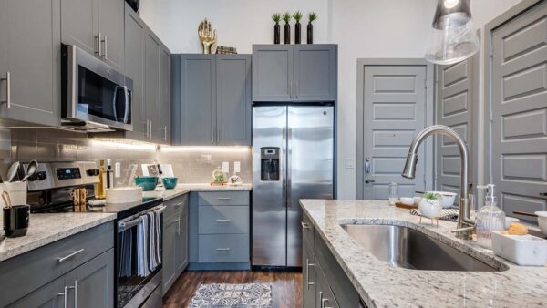 Griffis Frisco apartment kitchen with stainless steel appliances.