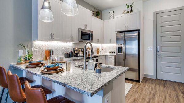 Griffis Frisco apartment kitchen with stainless steel appliances.
