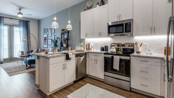 Griffis Frisco apartment kitchen with granite countertops.