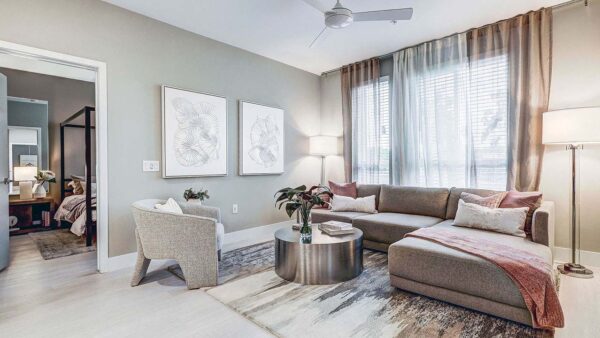 Griffis Platinum Triangle apartment living room with wood style floor.