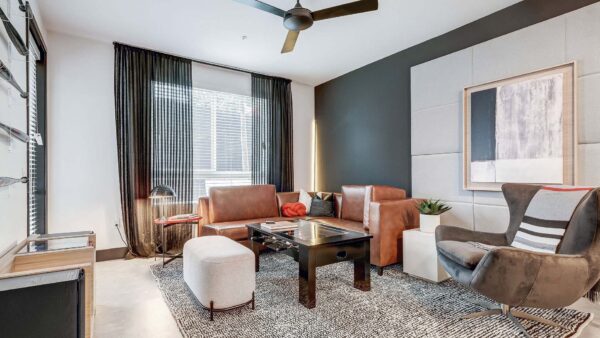 Griffis Platinum Triangle apartment living room with wood style floor.