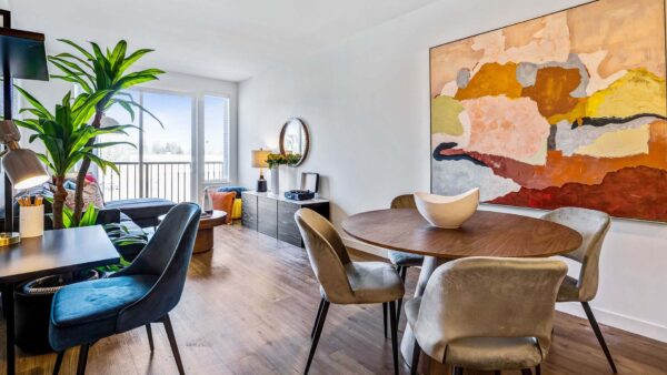 Griffis Shoreline apartment dining area with wood style flooring.