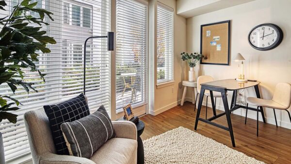 Griffis Shoreline apartment living room with wood style floor.