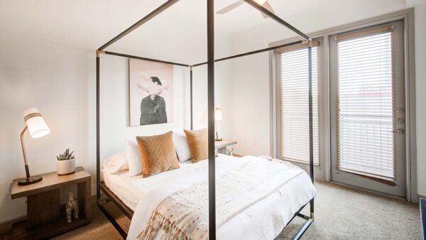 Griffis Uptown apartment bedroom with high ceilings.