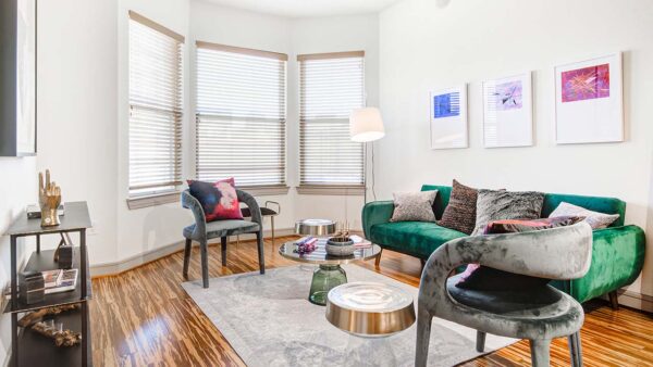 Griffis Uptown apartment living room with wood style flooring.