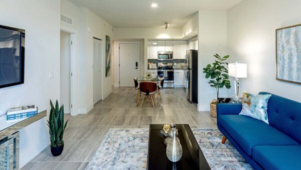 Griffis Pompano Beach apartment living room with wood style floor.