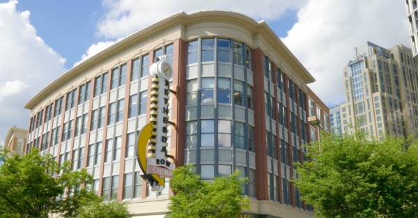 Historic Bethesda Theater building with its vertical marquee sign in downtown Bethesda.