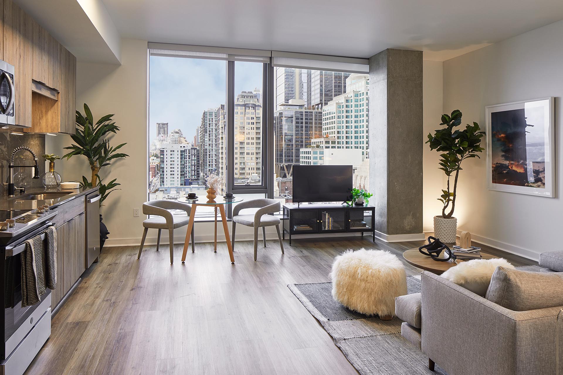 Griffis Seattle Waterfront open-concept apartment with kitchen, dining area, and floor-to-ceiling windows