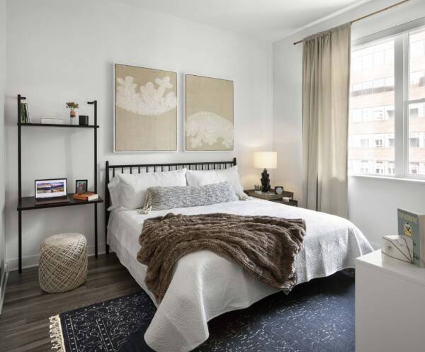 Griffis Cherry Creek North apartment bedroom with wood style floor.