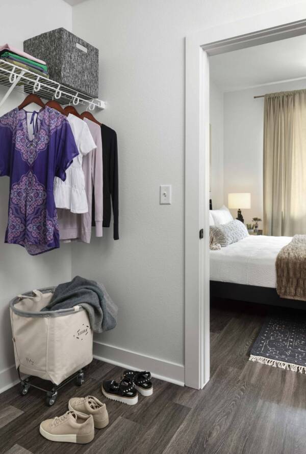 Griffis Cherry Creek North apartment bedroom closet with wood style floor.