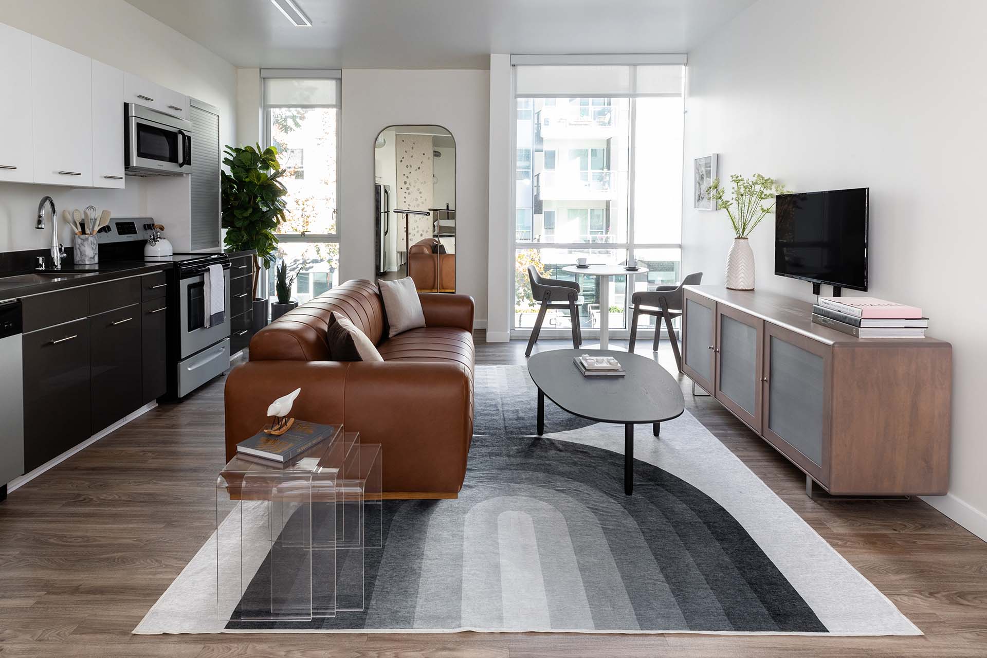 Griffis East Village apartment living room with wood style floor in San Diego, CA.