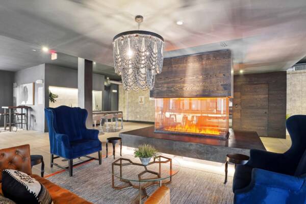 Griffis Oak Lawn apartment community resident lounge with fireplace in Dallas, TX.